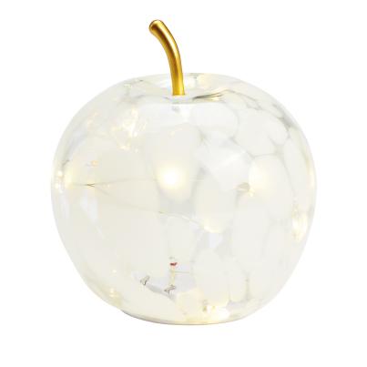 Glas-Apfel beleuchtet