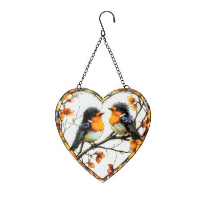 Fensterbild Vogel herzförmig